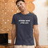 Working More Living Less sarcastic office humor t-shirt in navy — bold graphic print for overworked professionals