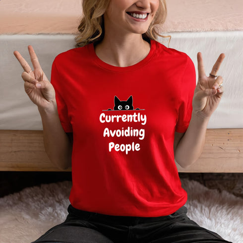 Funny introvert t-shirt in red with Currently Avoiding People print – humorous gift tee for antisocial friends