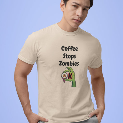 Coffee Stops Zombies Ok novelty coffee slogan tee in soft cream — lightweight unisex shirt for quirky humor lovers