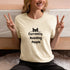 Currently Avoiding People graphic tee in soft cream – casual introvert humour shirt, perfect funny gift