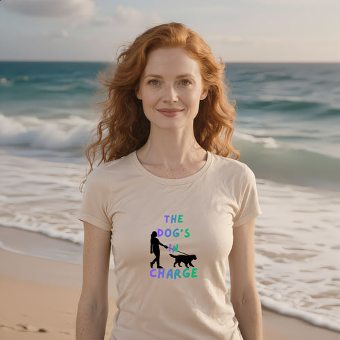 The Dog's In Charge dog mom shirt in soft cream — cute pet parent graphic tee, great gift for dog lovers