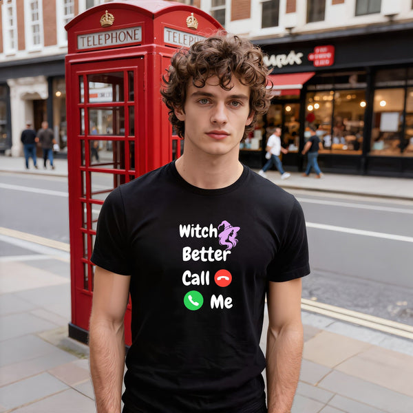 Model wearing a black Witch Better Call Me funny witch T-shirt with white lettering, a purple witch and red and green phone symbols.