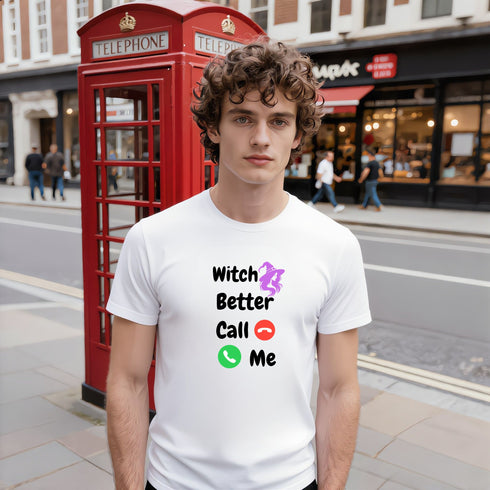White Witch Better Call Me witchy graphic T-shirt modelled beside a red telephone box, showing black text and a purple witch design.
